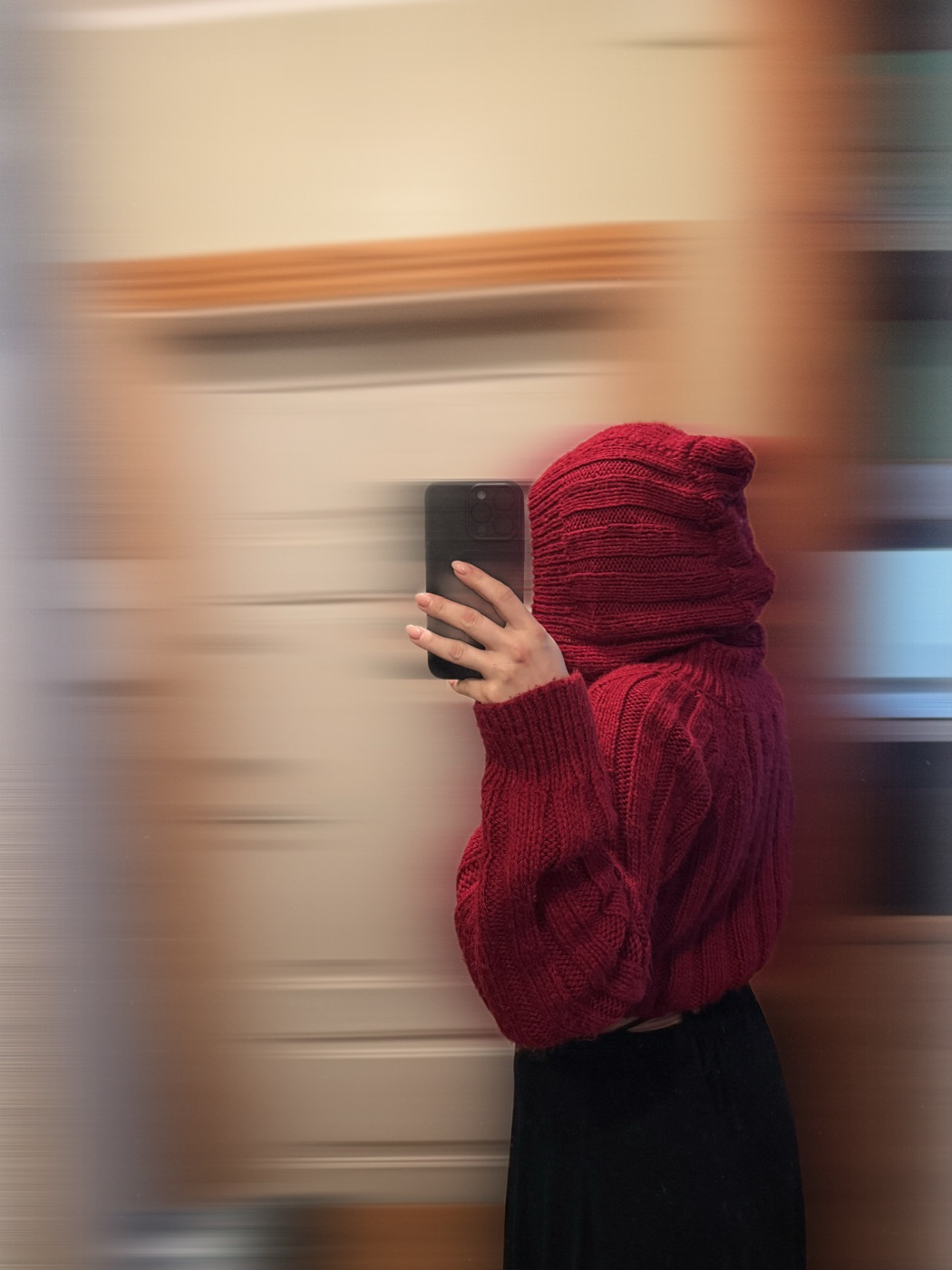 Red knit hood and sweater worn up