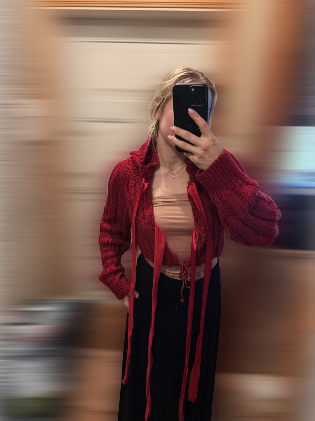 Red knit cardigan with long red ribbon ties